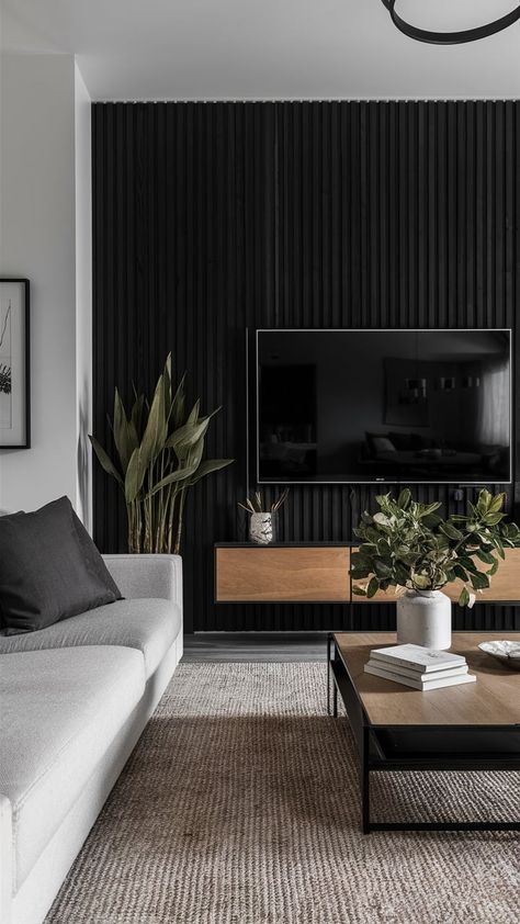 20 Innovative TV Wall Ideas That Effortlessly Blend Functionality and Aesthetics - SheBonny Best Tv Wall Design, Black Wood Slat Tv Wall, Modern Tv Room Wall, Black Tv Room Ideas, Black Tv Wall Ideas, Black Slat Tv Wall, Black Wall Tv Living Room, Black Panel Tv Wall, Tv Wall Decor Black