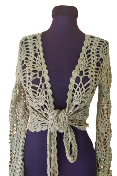 Need beachwear outfits for when you're headed to the beach? This will be one of the absolute favorite designs in your closet. The wrap style of the crochet top is great for pairing with both skirts and pants and playful touch to the boho style that crochet clothing provide. This olive green wrap tie cardigan is a fashion must-have. Wear for that summer outing in the park or over a swimsuit or tank top. Perfect for that layered look that you want. Hand crochet Knit Beach Top, Olive Green Sundress, Crochet Cardigan Tie Up, Wrap Crochet Top, Crochet Wrap Cardigan, Crochet Projects For Summer, Tie Cardigan Crochet, Crochet Green Top, Crochet Tie Cardigan