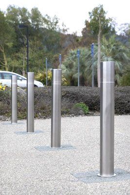 Stainless steel operable bollards provide a modern aesthetic Portable Fence, Stainless Steel Bolts, Light Pole, Traffic Safety, Stainless Steel Pipe, Iron Fence, Fence Panels, Modern Buildings, Home Decorators Collection