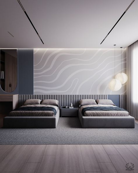 A modern design with grey and blue tones. The room has two sleek grey beds with blue bedding accents. The walls feature a trendy grey wave design and a textured panel behind the beds to offer a stylish appearance.
The use of gray and blue provides a peaceful and harmonious atmosphere.

#bedroom_design #modern_interior #home_decor #modern_bedroom_design Textured Wall Behind Bed, Hospital Bedroom, Bedding Accents, Grey Beds, Wall Behind Bed, Blue Gray Bedroom, Beautiful Bedroom Designs, Kids Bedroom Design, Relax And Unwind