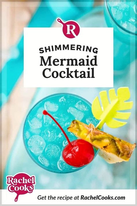 So pretty and so sweetly delicious, this Mermaid Lemonade (with a cotton candy twist!)! is the perfect cocktail for summer parties and special occasions. It's easy to make one drink or a pitcher full! This recipe starts with rum, pineapple juice, orange juice, lemonade, and blue Curaçao and then a cotton candy “bomb” filled with stunning turquoise luster dust is dropped into the glass, adding sweetness, shimmer and an extra pop of blue color. Fun, festive and so good! Mamma Mia Mocktails, Mermaid Lemonade, Blue Curacao Drinks, Summer Drink Menu, Mermaid Drink, Fruity Cocktail, Disney Dinner, Vodka Lemonade, Tonic Recipe