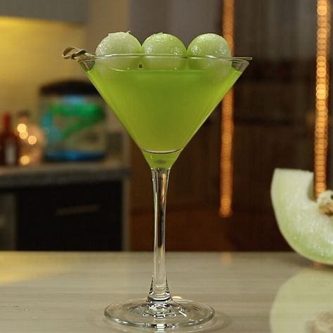 THE MELON BALL 2 oz. (60ml) Midori ® Melon Liqueur 1 oz. (30ml) Vodka Orange Juice Garnish: Melon Ball Skewer PREPARATION 1. In a shaking glass with ice, combine melon liqueur and vodka. Shake well. 2. Strain mix into a martini glass and top with orange juice. 3. Garnish with a melon ball skewer. DRINK RESPONSIBLY! Midori Recipes, Melon Ball Cocktail, Classic Vodka Cocktails, Vodka Orange, Orange Juice And Vodka, Midori Melon, Orange Vodka, Melon Liqueur, Vodka Cocktails Recipes