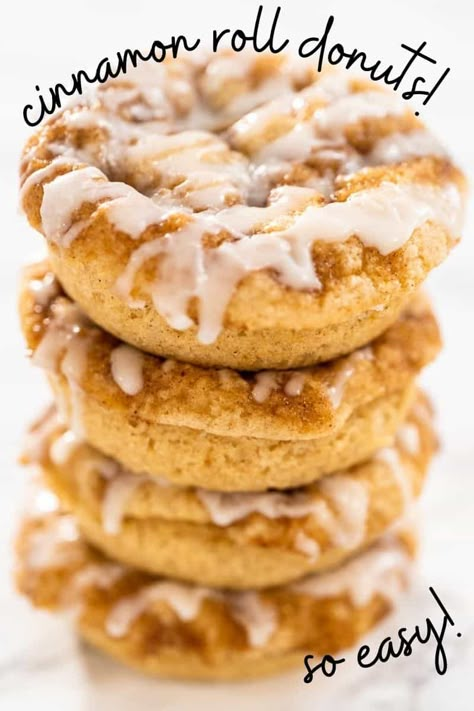 The perfect mix of an ooey gooey cinnamon roll combined and a fluffy donut that's ready in just 20 minutes! This oven baked donuts recipe is fool proof! A Cinnamon donuts recipe with a drizzle of frosting is the perfect addition to your morning coffee! You could even make these into cinnamon roll mini donuts! Cinnamon Roll Donuts Baked, Cinnamon Roll Doughnut, Fluffy Donut Recipe Baked, Baked Donuts With Donut Pan Cake Mixes, Oven Donut Recipe, Cinnamon Roll Donut, Donut Frosting Recipe, Oven Baked Donuts Recipes, Cinnamon Donut Recipe