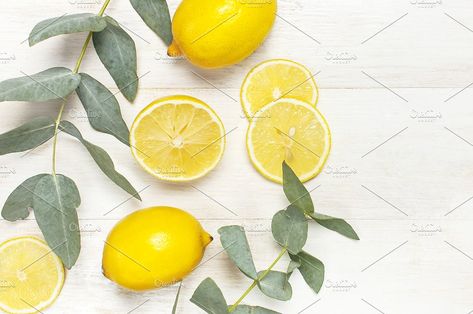 Whole and sliced lemon, eucalyptus by Arkhipenko_Olga on @creativemarket Sliced Lemon, Lemon Eucalyptus, Eucalyptus Leaves, Wooden Background, Top View, Concept Design, Lemon, Fruit, Orange