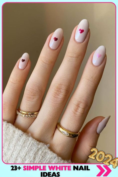 Almond-shaped white nails with heart accents, glossy finish. These sweet, medium-length simple white nails are ideal for dates and anniversaries, adding a romantic touch to your look. Simple White Nail Ideas, White Nails With Heart, Simple White Nails, White Nail Ideas, Anniversary Nails, Work Nails, White Nail, Romantic Design, Nails 2024