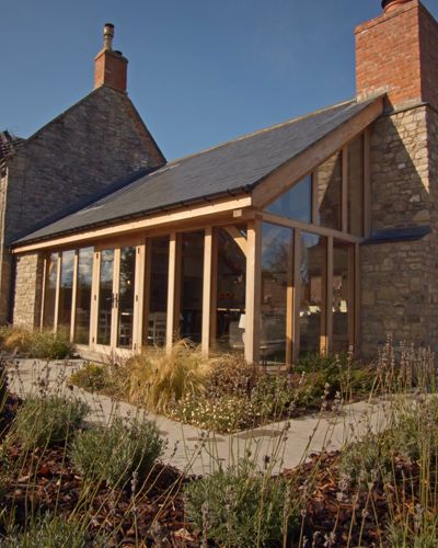 Oak And Glass Extension, Timber Frame Kitchen Extension, Wooden House Extension, Grand Designs Houses Uk, Country House Extension, Stone House Extension, This Oak House, Oak Frame Extension, Wooden Extension Ideas