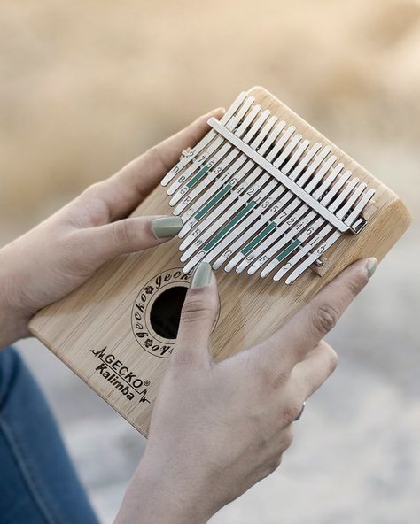 The Kalimba, also called a thumb piano, is a percussion instrument that originated from Africa many years ago. Originally, it was made of wood (and called an mbira). Modern kalimbas are constructed with a wooden sound board and metal tines. Tines are flat bars that can be tuned to different pitches. The thumb piano is played by gently pressing down and releasing the tines with-you guessed it-your thumbs! We used our kalimbas during the study of jazz pianist and activist Nina Simone as a way to p Jazz Pianist, Sound Board, Music Tutorials, Subscription Boxes For Kids, Percussion Instrument, Thumb Piano, Major Scale, Fun Songs, C Major