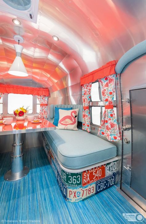 TimelessTravelTrailers-60sRetroAirbnb-2 Retro Airstream, Small Travel Trailer Remodel, Small Travel Trailer, Patterned Curtains, Dining Booth, Small Travel Trailers, Kitchen Design Styles, Airstream Interior, Galley Style Kitchen