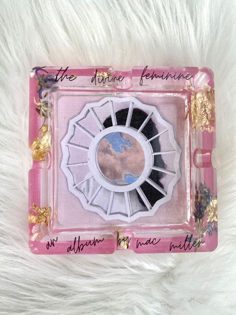 handmade resin art ashtray inspired by mac miller’s “the divine feminine” album. adorned with gold leaf and real pressed flowers. Grad Cap Mac Miller, Graduation Cap Mac Miller, Mac Miller Decor, Graduation Cap Designs Mac Miller, Mac Miller Grad Cap, Mac Miller Graduation Cap, Mr Macs, Apartment Finds, Grad 2023