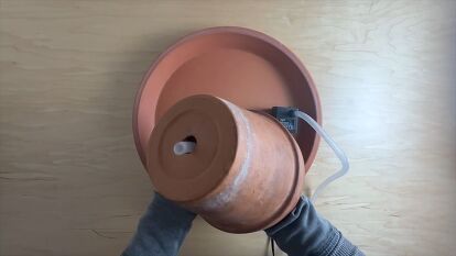 Dive into our step-by-step tutorial and creat a gorgeous homemade fountain for your outdoor space with terracotta plant pots. Crafting your own serene retreat has never been this easy! Homemade Water Fountains, Diy Slides, Diy Fountain, Terracotta Plant Pots, Fountain Pump, Terracotta Planter, Garden Oasis, Diy Planters, Garden Features