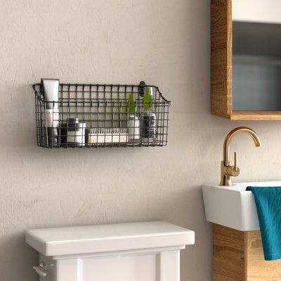 This vintage-inspired, wall-mounted basket organizer is designed to help you reduce clutter and create a tidy home. Made of sturdy steel, it's perfect for your pantry, kitchen, bathroom, office, bedroom, entryway, or closet. The easy-reach basket design features a slightly lower front end, making it simple to grab items quickly. We love that it comes with built-in brackets for hassle-free mounting, and the necessary hardware is included. With a width of 15.25", a height of 7.5", and a depth of 5 Shelf Baskets Storage, Garage Bedroom, Baby Room Diy, Pantry Kitchen, Wire Basket Storage, Wall Hanging Basket, Wall Baskets, Basket Organizer, Storage House