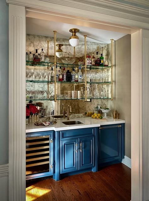 This family’s gorgeous dining room leads into a butler’s pantry complete with an authentic French wet bar. Featuring Palmer’s ceiling and wall mounted Ball style bistro shelving unit set against an antiqued mirrored backsplash, every detail was clearly and carefully thought out. Designer @kristinaphillipsinteriordesign for k+k Mirror Backsplash Bar, Small Home Bar, Small Home Bar Ideas, Built In Wet Bar, Bistro Shelving, Small Bars For Home, Home Bar Ideas, Home Bar Setup, Bandeja Bar