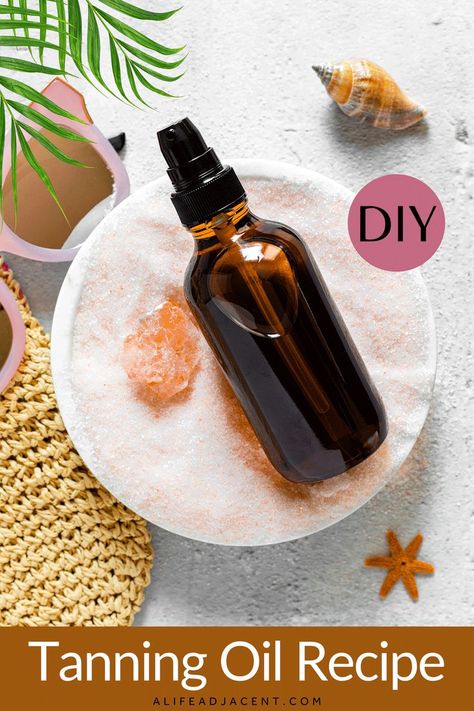 DIY tanning oil in pump bottle sitting in pile of sand with beach bag and sunglasses. Diy Tanning Oil Recipes, Tanning Oil Recipe, Diy Tanning Oil, Tanning Oil Homemade, Tan Skin Natural, Tan Faster, Summer Skincare Products, Diy Tanning, Bronzing Oil