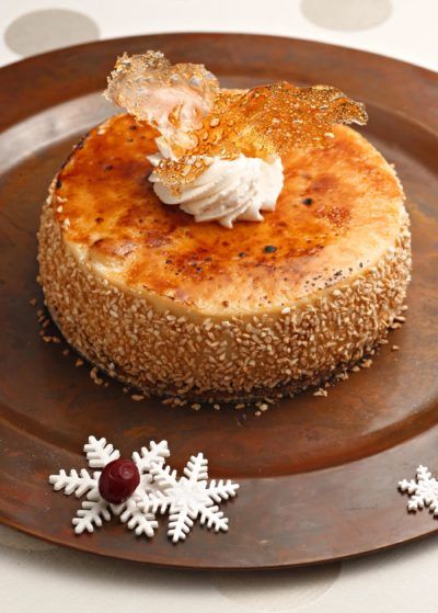 Eggnog brûlée cheesecake with gingerbread crust Cheesecake With Gingerbread Crust, Gingerbread Crust, Culinary Torch, Eggnog Cheesecake, Salted Caramel Cheesecake, Trifle Desserts, Caramel Cheesecake, Bakery Desserts, Holiday Guide