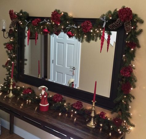 Christmas Lights Around Mirror, Christmas Decorations Mirror, Christmas Decor Ideas For Mirror, Mirror Decor Christmas, How To Decorate A Mirror For Christmas, Mirror Garland Christmas, Christmas Decor Mirror, Mirror Christmas Decor Ideas, Christmas Mirror Decorations Ideas