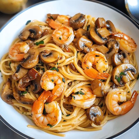 Mushroom Garlic Shrimp Pasta features tender shrimp, sautéed mushrooms, and garlic in a creamy sauce over pasta. Creamy Shrimp Pasta With Mushrooms, Mushroom And Shrimp Recipes, Shrimp And Mushroom Pasta, Mushroom Zucchini Recipe, Shrimp Mushrooms, Garlic Shrimp Pasta Recipes, Shrimp Stuffed Mushrooms, Mushroom Garlic, Shrimp Zucchini