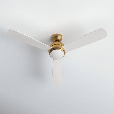 With a minimalist, contemporary design, the Erina 52 LED fan can complement a wide variety of room styles. It’s offered in four finish combinations to suit virtually any décor. A hard-wired wall control is included. Ideal for use in great rooms, living rooms, bedrooms, and bonus rooms. Fan Body Finish: Satin Brass, Blade Finish: Matte White | Birch Lane™ Erina 52" Ceiling Fan w / LED Lights in White / Yellow | 14.6 H x 52 W in | Wayfair Great Room Ceiling Lights, Ceiling Fan With Light And Remote, Ceiling Fan In Vaulted Living Room, White And Brass Ceiling Fan, Antique Ceiling Fan, Ceiling Fixtures Living Room, Modern Bedroom Fans With Lights, Sleek Ceiling Fan, Ceiling Fan Cathedral Ceiling