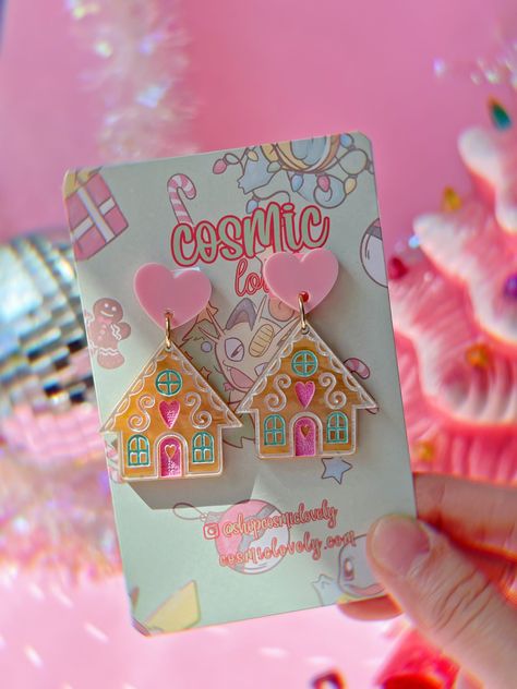 This listing is for ONE Pair of Pastel Christmas Gingerbread House Earrings. If you wish to replace hardware to leverbacks, ball posts, or hooks please leave me a note at check out. Earring post backs are hypoallergenic. Earrings are approximately 2in in length.  *Follow me on IG for shop updates! @shopcosmiclovely Gingerbread House Earrings, Pink Christmas Earrings, Acrylic Christmas Earrings, Toothpaste Kisses, Diy Christmas Earrings, House Earrings, Glowforge Projects, Pastel Earrings, Pastel Christmas