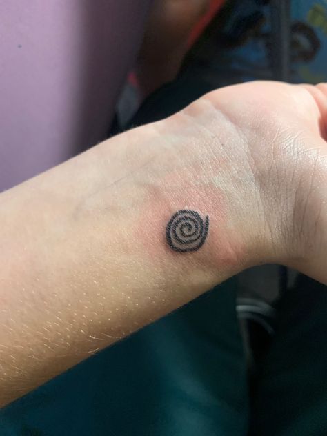 Tattooed spiral design Spiral Wrist Tattoo, Blue Spiral Tattoo, Spiral Tattoo Placement, Spiral Hand Tattoo, Swirl Tattoo Spirals, Spiral Sun Tattoo, Organic Tattoo Design, Spiral Tattoo Ideas, Koru Tattoo