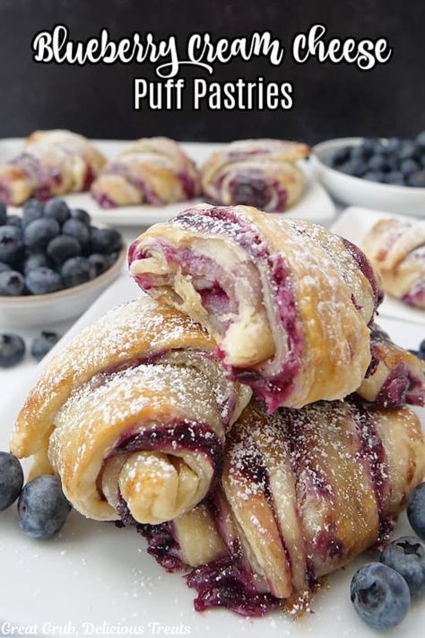 This flaky, sweet and delicious, blueberry cream cheese puff pastry dessert combines the sweet taste of fresh blueberries with a cream cheese mixture and is baked until golden and flaky, and dusted with powdered sugar. As I mentioned in a previous pastry post – in a lot of them, probably – I love making pastries....Read More Mulberry Puff Pastry, Blueberry Crossiant, Cream And Berry Pastry Balls, Cream And Berry Filled Pastry Balls, Blueberry Puff Pastry Recipes, Pastry Sheet Recipes, Quick Pastries, Things To Make With Puff Pastry, Recipes Using Puff Pastry Sheets