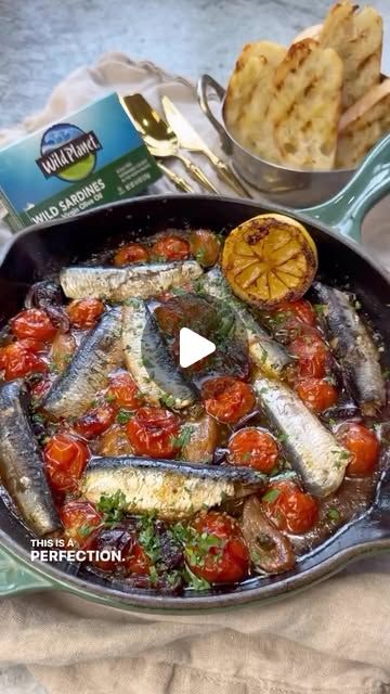 Seafood Network🦞🦐🦀🦑🐙🍤 on Instagram: "Baked Sardines in White Wine Tomato Sauce with Garlicky Baguette Crostini. 
@vessys_gourmet_kitchen ❤️

Sardines are considered a Superfood as they are low in calories and high in nutrients such as Calcium, Vitamin D, B12, Iron, Omega-3 fatty acids and more! 

Ingredients: 
2 cans Wild Sardines (lightly smoked) in extra virgin olive oil 
8 oz cherry/grape tomatoes 
1/4 red onion, thinly sliced 
1/4 cup Kalamata olives 
1 tbs capers 
10 garlic confit cloves 
3 tbs garlic confit oil 
1/4 cup white wine 
1/2 tsp Italian seasoning 
1/2 lemon, juiced+ zested 
1 tbs parsley, for serving 

For the garlic confit: (note: you won’t use it all for one recipe)
2 garlic heads 
1/2 cup olive oil 
1/2 tsp salt 
2 thyme sprigs 
1 rosemary spring 
A scrunch of bla Baguette Crostini, Baked Sardines, Garlic Confit, All For One, Garlic Head, Gourmet Kitchen, Kalamata Olives, Gourmet Kitchens, Grape Tomatoes