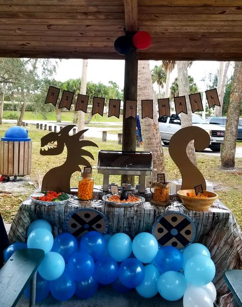 Dragon viking party ideas Dragon Bday Party Ideas, Vikings Party Decorations, Barbarian Theme Party, Viking Themed Halloween Party, Viking Trunk Or Treat Ideas, Viking Gender Reveal, Viking Decorations Party, Midevil Birthday Theme, Dragon Decorations Party