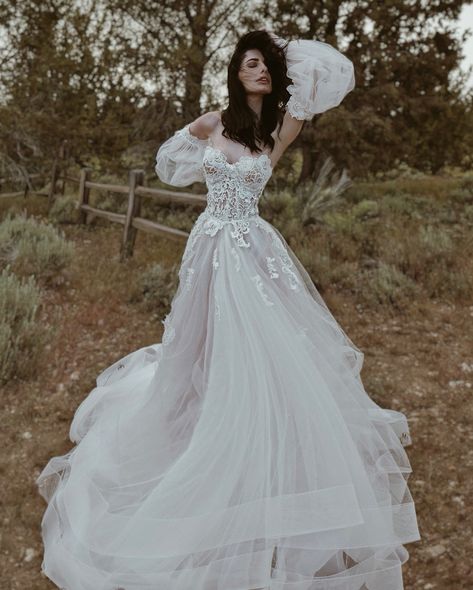 “Love is a canvas furnished by nature, and embroidered by the imagination.” ~ Voltaire “PASTORA” gown from our WILDBLOOM Collection 🌸 She’s a romantic guipure lace bustier ball gown with layers of tulle and organza and waterfalls of delicate hand appliqués. Customize “Pastora” in unlimited ways, and pair with accessories like detachable sleeves. Now available for fittings at our LA Flagship and a upcoming trunk shows! Call/text 310.595.1101 to book or with any questions! #PASTORAgown... Gowns With Trains, Lauren Elaine Bridal, Custom Wedding Dresses, Bohemian Wedding Dress Lace, Detachable Sleeves, Lace Bustier, Custom Wedding Dress, Bridal Fashion Week, Bridal Inspo