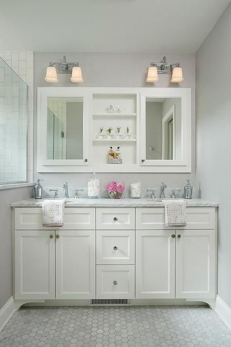 White and gray shared girls bathroom feature shelves between framed medicine cabinets lit by two light sconces. Makeover Kamar Mandi, Bathroom Vanity Designs, Decorating Bathroom, Small Bathroom Vanities, Bad Inspiration, Vanity Design, Trendy Bathroom, Girls Bathroom, Bathroom Redo