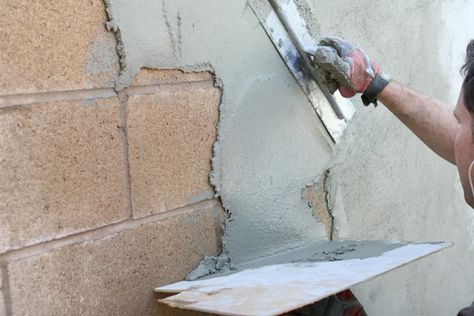 I'm looking to "stucco" the wall with a cement/stand mixture... technically it's parging, not stuccoing Diy Stucco Exterior, Stucco Patio, Diy Stucco, Stucco Repair, Fancy Home, Concrete Block Walls, Cinder Block Walls, Cinder Blocks, Outdoor Remodel