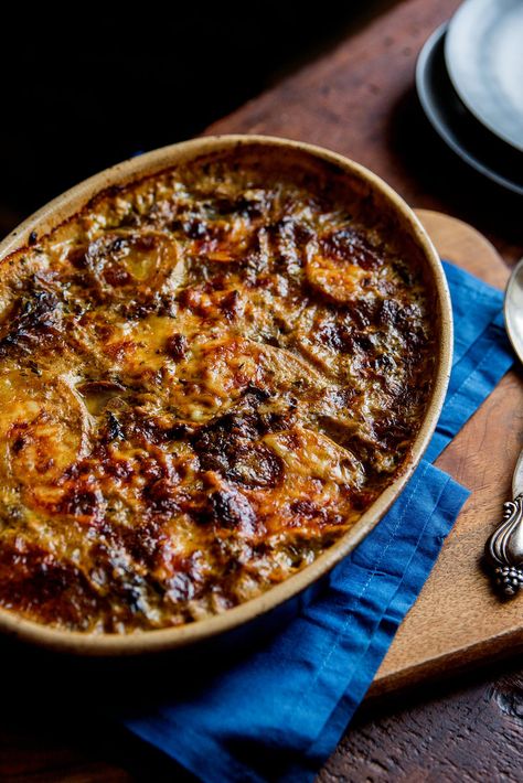 NYT Cooking: Wild mushrooms add a luxurious dimension to this comforting, almost classic potato gratin. There is no cream here, just milk mixed with porcini broth (the result of soaking dried porcinis for 30 minutes in boiling water). You can use a mix of wild mushrooms, or just one type. Sauté them with onion or shallots, garlic and savory herbs (thyme and rosemary or sage), seaso... Potato Gratin Recipe, Wild Mushroom Recipes, Asian Seasoning, Cooking Vegetables, Savory Herb, Potato Gratin, Wild Mushroom, Nyt Cooking, Wild Mushrooms