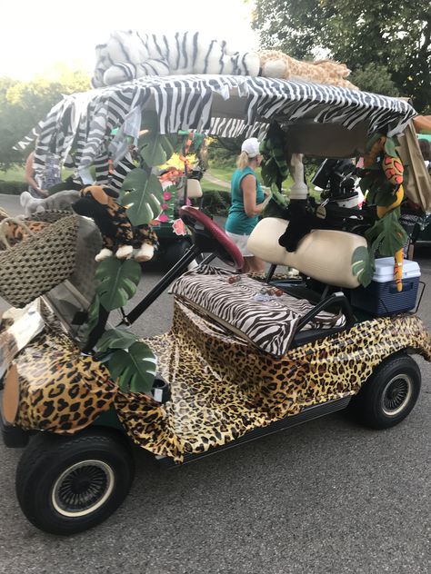 Jungle theme member/member for golf....we won the decorating prize! Wild About Golf Theme, Safari Golf Cart Decorations, Safari Float Parade, Safari Parade Float Ideas, Golf Cart Decorating Ideas Summer, Decorated Golf Cart Ideas, Jungle Theme Costume, Bev Cart, Golf Cart Decorating Ideas