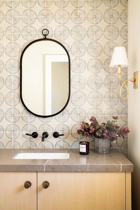 Beige and blue backsplash tiles complement an oval black mirror hung over an oil rubbed bronze wall mount faucet. Spanish Bathrooms, Grey Bathroom Floor, Interior Finishes, Blue Backsplash, Bathroom Floor Tiles, Modern Coastal, Bath Remodel, Free Standing Bath Tub, Bathroom Makeover