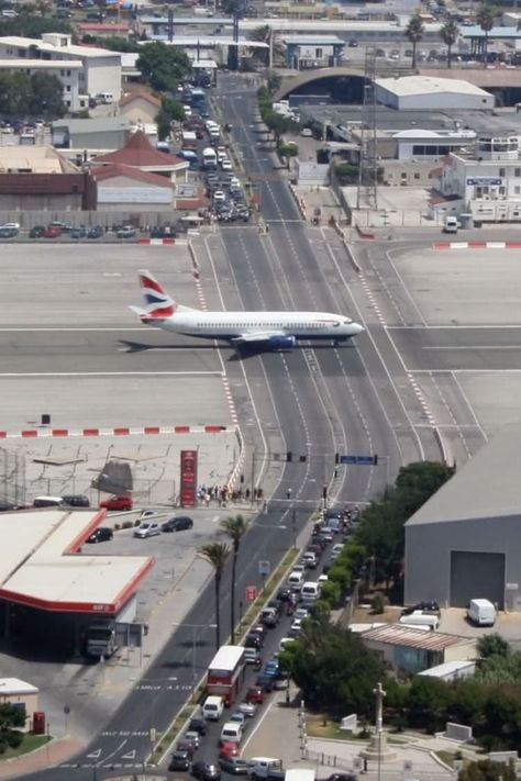 Gibraltar International Airport The worlds only airport runway intersecting a road. Gibraltar Airport, Aviation Humor, British Overseas Territories, Airport Design, British Airways, Progress Pictures, Traffic Light, International Airport, Cool Pictures