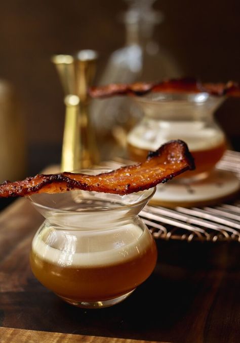 This glorious maple whiskey sour with candied bacon has all my favourite things in it, and it feels oh-so-Canadian to me. It was inspired by a drink I had at my favourite breakfast place in Calgary: Queen's Breakfast and Cocktails. They call it the Wakey Wakey Eggs and Bakey, and I IMMEDIATELY went home to try and replicate it - this is the result. It's the perfect curling up by the fire on a November morning in Calgary type of drink (yes I said morning. Don't @ me). Here me out on why… Maple Whiskey Sour, Maple Whiskey, Whisky Sour, Breakfast Ingredients, Breakfast Places, Candied Bacon, Whiskey Sour, Bacon Recipes, Recipe Details