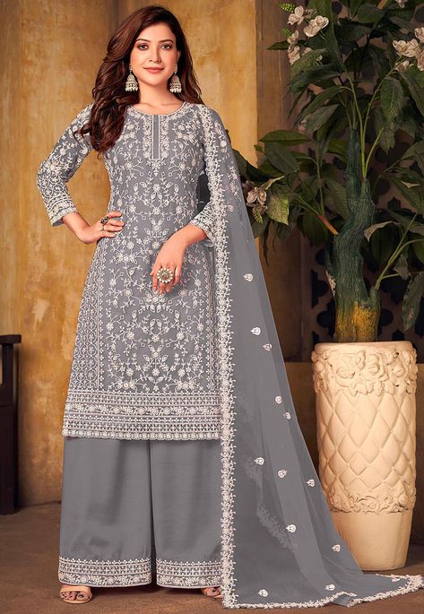 Semi-Stitched Net Pakistani Suit in Grey This Attire with Poly Shantoon Lining is Beautifully Enhanced with Resham, Sequins and Patch Border Work, Crafted in Round Neck and Quarter Sleeve Available with a Poly Shantoon Palazzo and a Net Dupatta in Grey The Kameez and Bottom Lengths are 42 and 40 inches respectively Do note: Accessories shown in the image are for presentation purposes only and length may vary upto 2 inches.(Slight variation in actual color vs. image is possible). Grey Punjabi Suit, Grey Suit With Purple, Latest Traditional Dresses, Purple Dupatta, Palazzo Suit, Indian Sarees Online, Readymade Saree, Palazzo Pant, Grey Suit