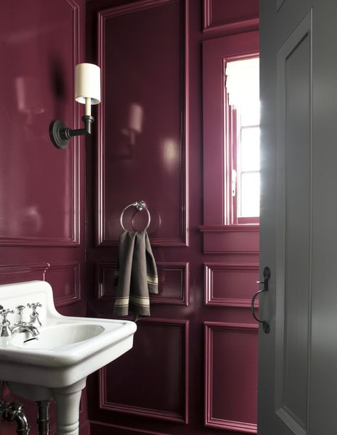 The rich color pigments of the 18th and early 19th centuries’ led Benjamin Moore to create the 144-color traditional Williamsburg® Paint Color Collection. Carter Plum CW-355 comes to life in this striking powder room. A small bathroom with a big impact.  Walls: Carter Plum CW-355, ADVANCE® High-Gloss // Door: Geddy Gray CW-720, ADVANCE® Satin. Lacquer Powder Room, Benjamin Moore High Gloss Paint, Lacquered Powder Room, Aubergine Bathroom Ideas, Raspberry Wall Paint, Mauve Paint Bathroom, Raspberry Bathroom Ideas, Plum Powder Room, Plum Laundry Room