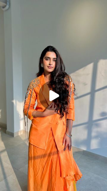 Bhavdeep Kaur on Instagram: "For those who like to stay warm yet dress glam this stunning blazer with drape skirt is a perfect fit!! 🧡🪩✨
You can wear it for a mehendi, sangeet, haldi/saint and many more events that you’ve to attend this wedding season. This stark orange pure silk set with mirror work detailing has my heart and I’m sure to wear on repeat as both the pieces can even be styled separately and reused. 

Wearing @youngberry_official 
Heels @zara 
Earrings @kundanjewellers.official 
Shot by @harkaranvaid 

#reels #reelsinstagram #festive #wedding #finds #wiw #lotd #outfit #blazer #mirror #inspo #youngberry #yb #orange #drapeskirt #trending" Mehendi Dress Outfits, Orange Dress Outfit Wedding, Bhavdeep Kaur, Orange Dress Outfits, Mehendi Dress, Zara Earrings, Outfit Blazer, Mehendi Outfits, Festive Wedding