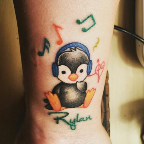 Penguin tattoo in memory of my son, Rylan. Penguin because he told me in a dream he wanted to hug a fluffy one, and penguins mate for life- and Rylan was my soul mate. Headphones and music notes because he LOVED his music and we rocked and sang every day. The colorfulness was bright, like his room, his memory quilt and yearbook page. I often called him a horse of a different color. Headphones Tattoo, Penguin Tattoo, Awareness Tattoo, Dandelion Tattoo, Bestie Tattoo, Tattoos For Women Half Sleeve, Tattoo For Son, Music Tattoos, Memorial Tattoos