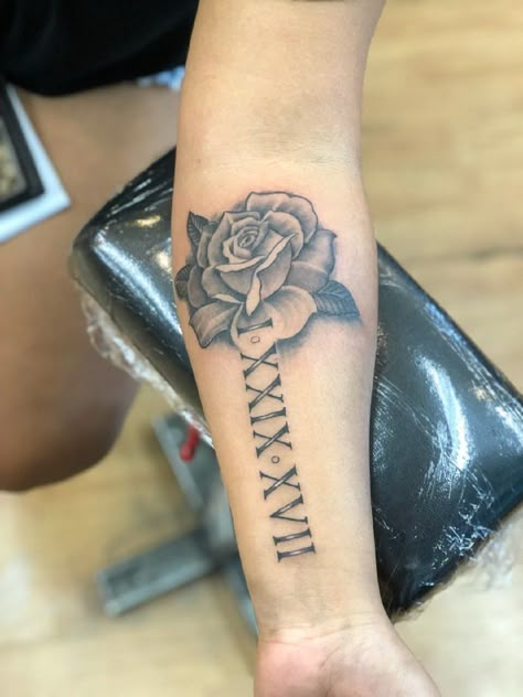 Roman Numeral Rose Tattoo, Rose And Roman Numeral Tattoo, One Rose Tattoo, Red Roman Numeral Tattoo, 2006 Tattoo Ideas, Small Tattoos For Guys Arm, Roman Numerals Tattoo, Numerals Tattoo, Memorial Tattoo Ideas