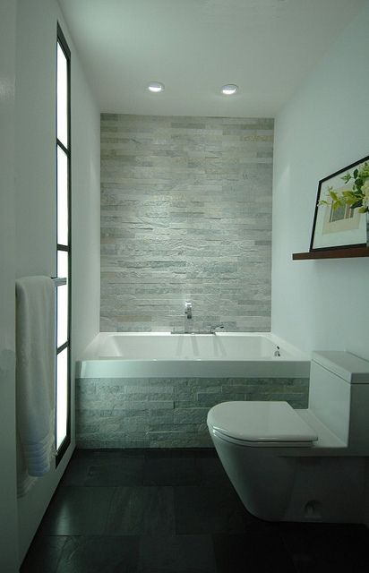 This transitional styled bathroom features ceramic tile walls and natural stone floors accented with glass and stone mosaic. Description from pinterest.com. I searched for this on bing.com/images Bilik Air Kecil, Small Bathroom Tile Ideas, Beautiful Small Bathrooms, Small Bathroom Tiles, Bilik Air, White Tub, Gorgeous Bathroom, Modern Baths, Hus Inspiration