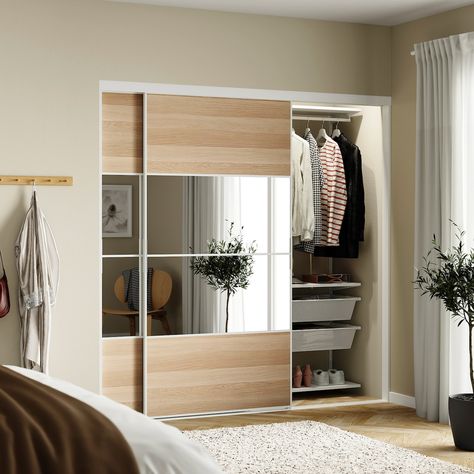 SKYTTA / BOAXEL reach-in wardrobe with sliding door, white Mehamn/Auli/white stained oak effect mirror glass, 79 1/2x25 5/8x80 1/2 ". You can fit more than you think in a limited area. BOAXEL wall-mounted storage system is easy to mount and takes care of all your clothes and shoes in the bedroom and in smaller walk-in wardrobes. Aluminium (min. 70% recycled). Small Walk In Wardrobe, Dressing Ikea, Door Alternatives, Rectangular Living Rooms, White Wardrobe, Sliding Wardrobe Doors, Stained Oak, Sliding Closet Doors, Kitchen Installation