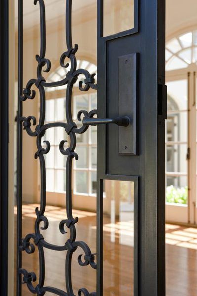 Whether you have a screen door or a decorative wrought-iron door or gate, the doors are heavy and last a long time when you take care of them. The screen will probably wear out before the door does on a screen door, which you can easily replace. But when it's time to clean wrought-iron doors or gates or you notice ... Wrought Iron Security Doors, Metal Screen Doors, Decorative Screen Doors, Iron Security Doors, Wrought Iron Front Door, Metal Front Door, Iron Front Door, Rod Iron, Facade Lighting