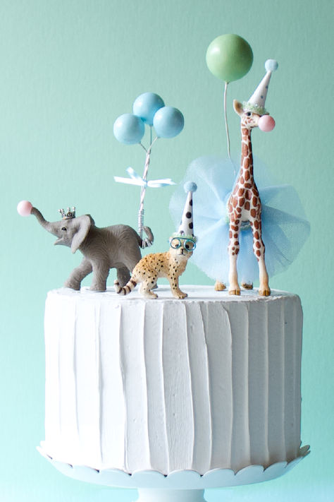 elephant, giraffe, and baby cheetah in blues and greens Safari Birthday Party Cake, Plastic Animal Crafts, Animal Cake Toppers, Party Animal Cake, Baby Cheetah, Animal Birthday Cakes, Jungle Birthday Party, Wild One Birthday Party, Safari Birthday Party