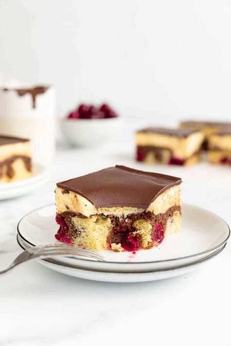 Donauwelle or Snow White Cake is a delicious layered dessert recipe made of pound cake, buttercream, sour cherries, and chocolate glaze. Perfect for birthdays, anniversary, baby shower or other celebrations. Simple dessert that tastes amazing. #jernejkitchen #Donauwelle #Donauwellen #snowwhitecake #layereddessert #dessertrecipe #buttercream Snow White Cake, Pastry Cream Recipe, Cheesecake Oreo, Layered Dessert, Sour Cherries, Sour Cream Coffee Cake, Cake Buttercream, Simple Dessert, Chocolate Glaze