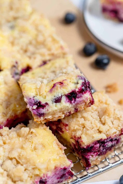 These Blueberry Cheesecake Bars have a sweet and creamy cheesecake filling that's bursting with juicy fresh blueberries, on top of a sweet, oaty crumbly crust, finished with a crunchy crumble topping! | blueberry cheesecake bars easy | blueberry cheesecake bars recipe | blueberry cheesecake bar recipes | blueberry crumble top cheesecake bars Lemon Cream Cheese Coffee Cake, Blueberry Lemon Cream Cheese, Lemon Blueberry Coffee Cake, Blueberry Crumble Cake, Lemon Crumb Cake, Blueberry Coffee Cake Recipe, Blueberry Pie Bars, Cheese Coffee Cake, Blueberry Crumb Cake