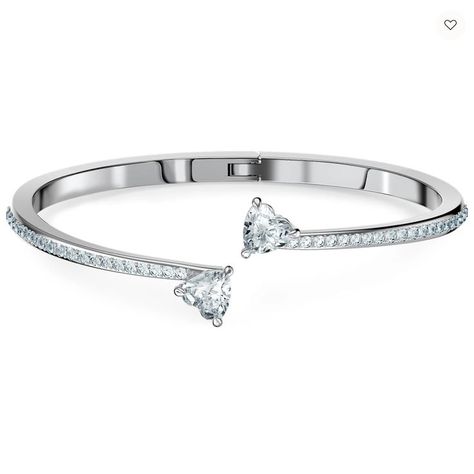 Artful simplicity and a hint of romance make this Swarovski bangle an ideal gift for a special person. The rhodium-plated design is supremely elegant and features two beautiful interconnecting heart-shaped stones as a centrepiece. A gorgeous gift to make your loved one's eyes sparkle. #swarovski #bracelet #silver #pendant #gift #idea #diamond #jewellery #heart #collection #perfume #inspiration 3d Silhouette, Heart Bangle Bracelet, Shaped Crystals, Swarovski Heart, The Bangles, Golden Trio, Swarovski Bracelet, Open Bangle, Silver Bangle Bracelets