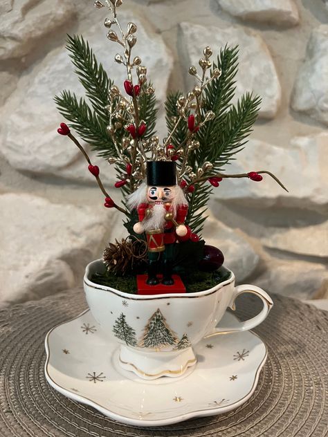 Nutcracker in a Christmas teacup. Saucer measures 6" and is approximately 8" high. Christmas Tea Decorations, Christmas Tea Cup Crafts, Teacup Crafts Diy, Teacup Centerpieces, Teacup Decor, Tea Cup Projects, Teacup Christmas, Tea Cup Decor, Christmas Afternoon Tea