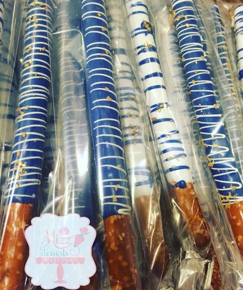 Chocolate covered pretzel rods Graduation Pretzel Rods, Blues Clues Pretzel Rods, Blue And White Pretzel Rods, Blue Pretzel Rods, Royal Blue Chocolate Covered Pretzels, Blue Chocolate Covered Pretzels, Blue And White Chocolate Covered Pretzels, Quince Food, White Pretzels