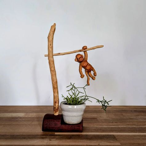 Request number 2 complete! After a few weeks of being sidetracked by other projects and simply avoiding something that was a bit difficult I've finished The Monkey. Not only is he a hanging sculpture his base is also a plant stand for a very little plant. The monkey is made from reclaimed Kauri Pine and the rest is made from various found timber, all found with my favourite danish oil. #woodworkaustralia #woodcarving #woodmonkey #woodcrafts #whittingaustralia #whittling #plantstand #reclai... Monkey Plant, Power Carving, Hanging Sculpture, Support Pour Plante, Wood Animal, Reclaimed Timber, Danish Oil, Wood Carved, Love Craft