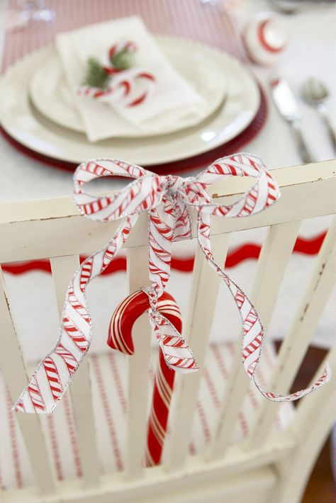 A large candy cane with a large bow always is a nice touch on the back of your dining room chairs Christmas Candy Cane Decorations, Canes Decor, Candy Cane Ornament, Red White Christmas, White Christmas Decor, Best Candy, Diy Candy, Chair Decorations, Noel Christmas